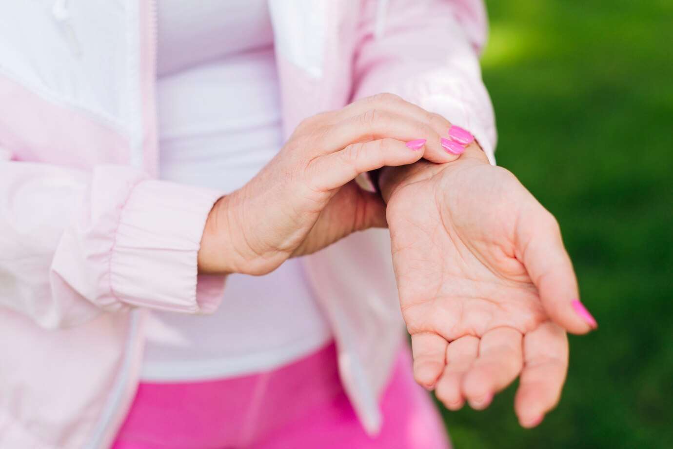 close-up-woman-measuring-her-pulse-outdoors_23-2148247259