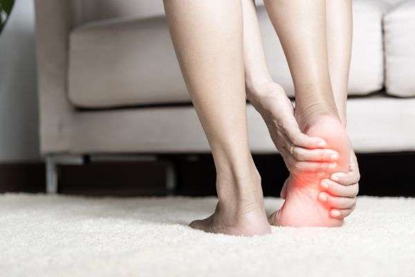 Heel pain caused by plantar fasciitis, showing inflammation relieved through stretching and exercise